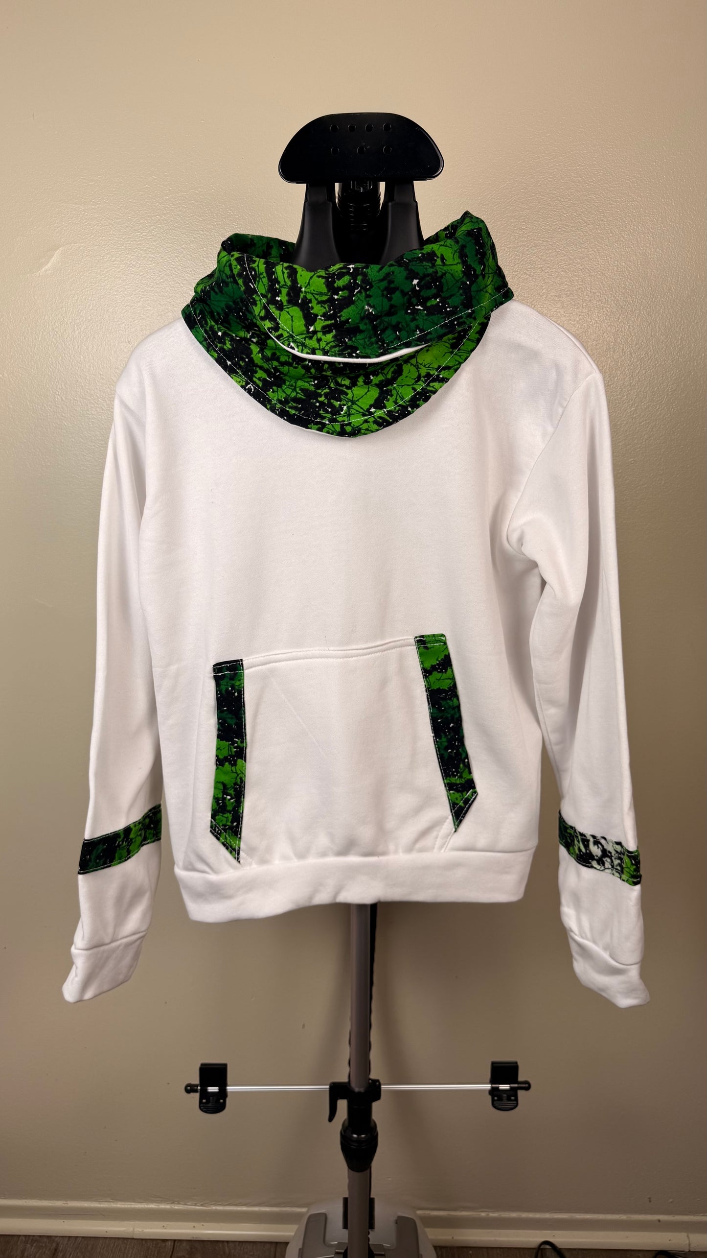white, long-sleeved hoodie with Greenish prints
