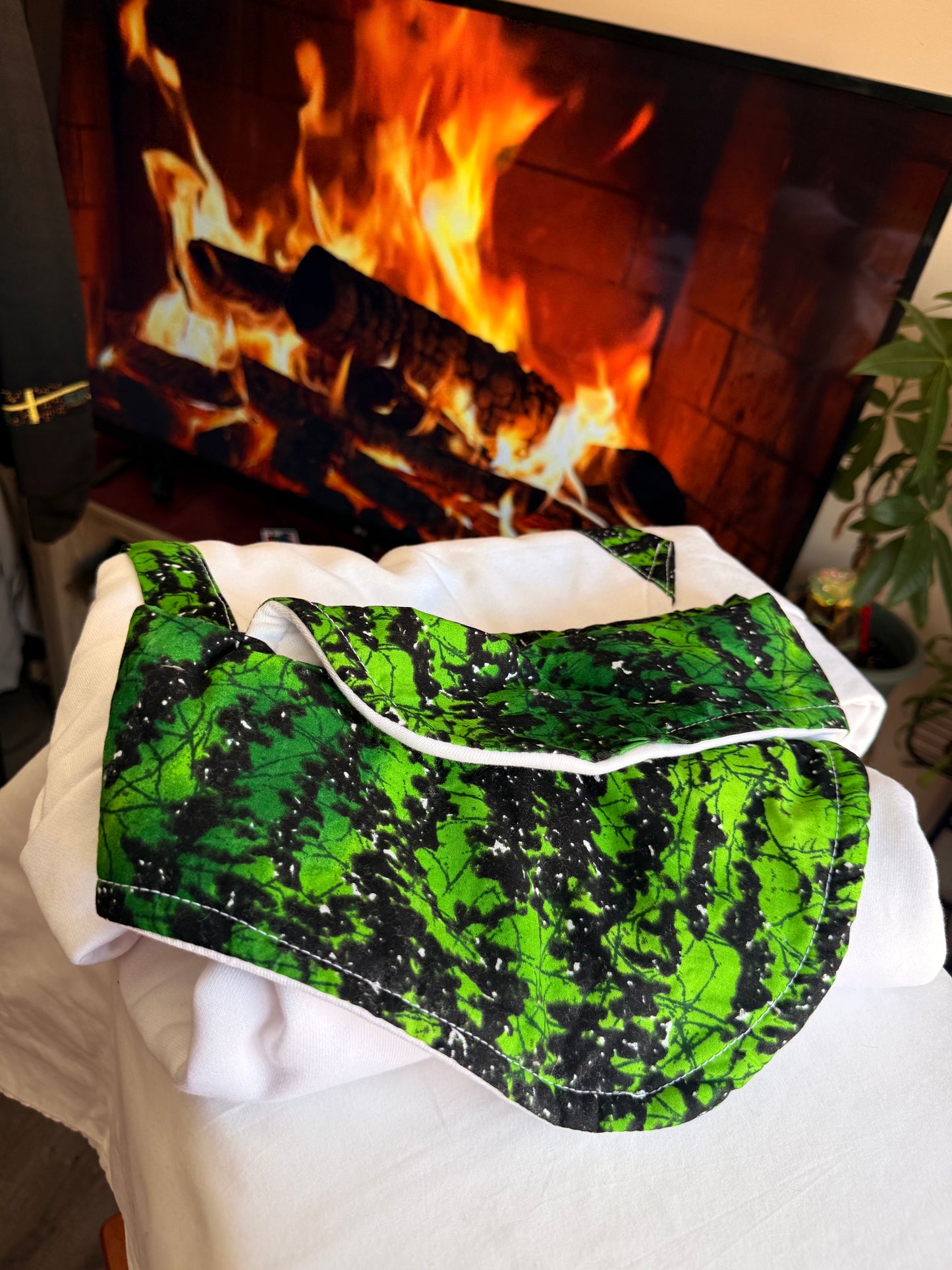 white, long-sleeved hoodie with Greenish prints